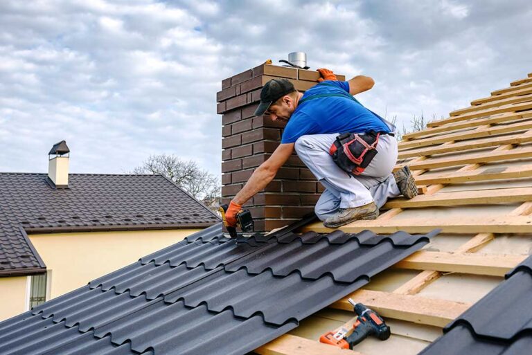 Homeowners review a roofing estimate with a contractor beside a residential roof.